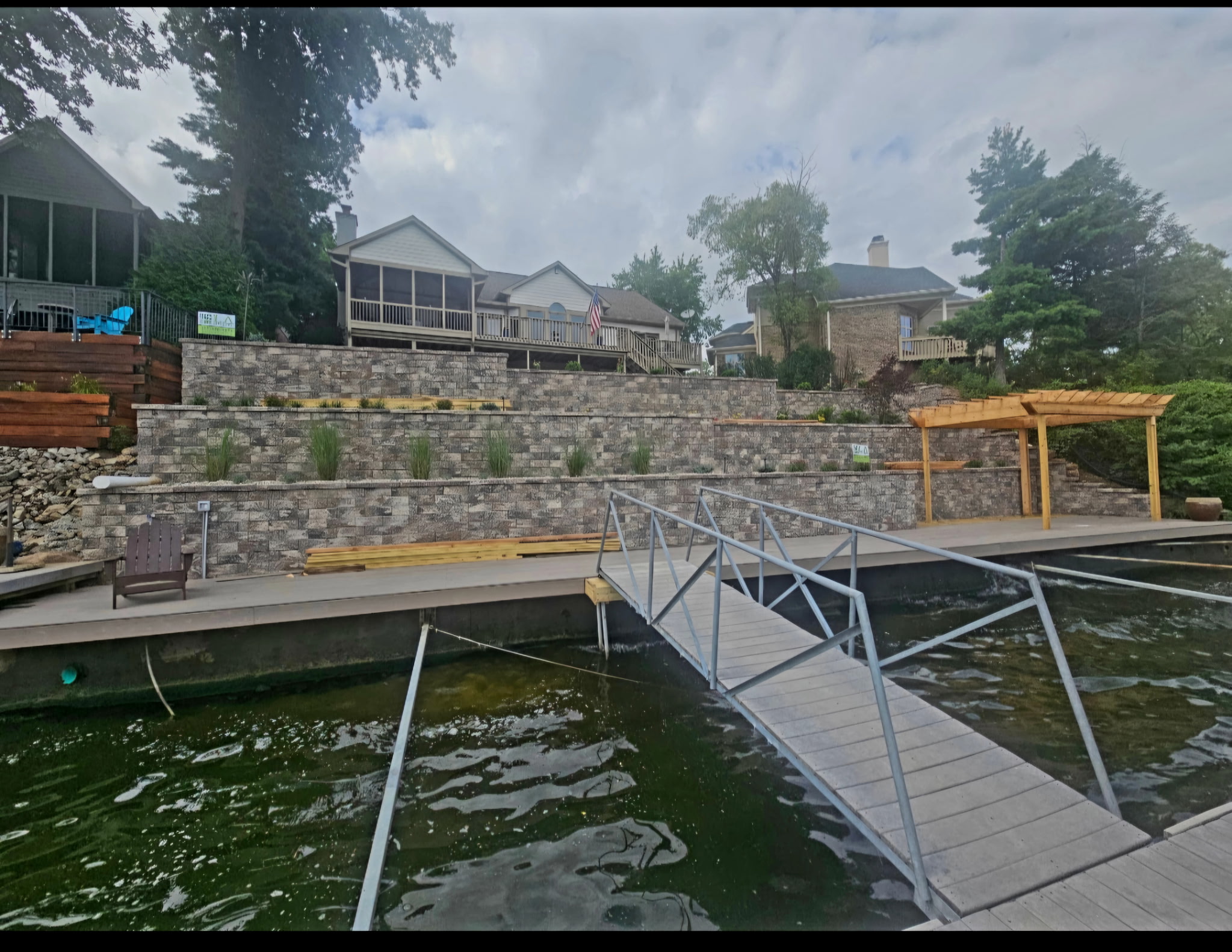 Lakeside seawall and pergola on Morse Reservoir by LA Landscapes Inc