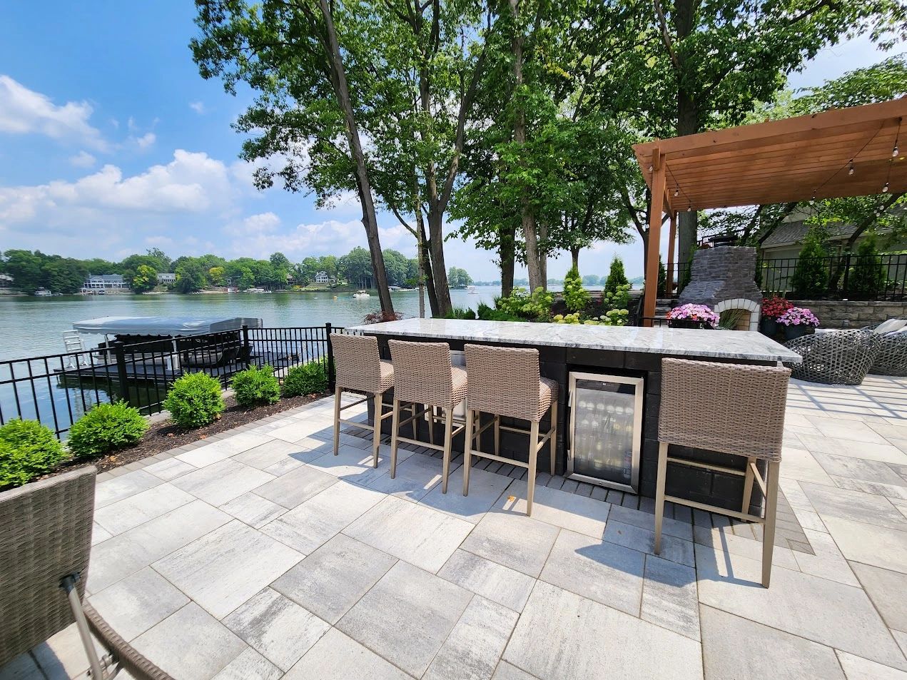Lakeside dining terrace under a pergola